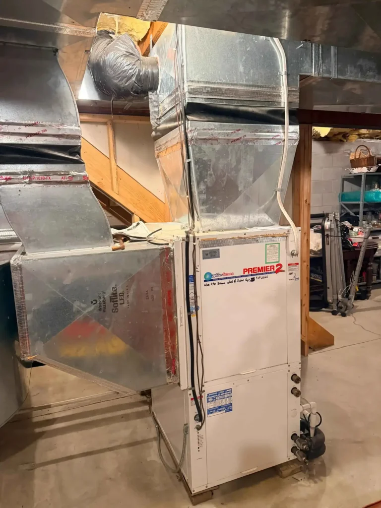 Furnace in a basement with ductwork, illustrating how it heats homes in New Jersey during winter
