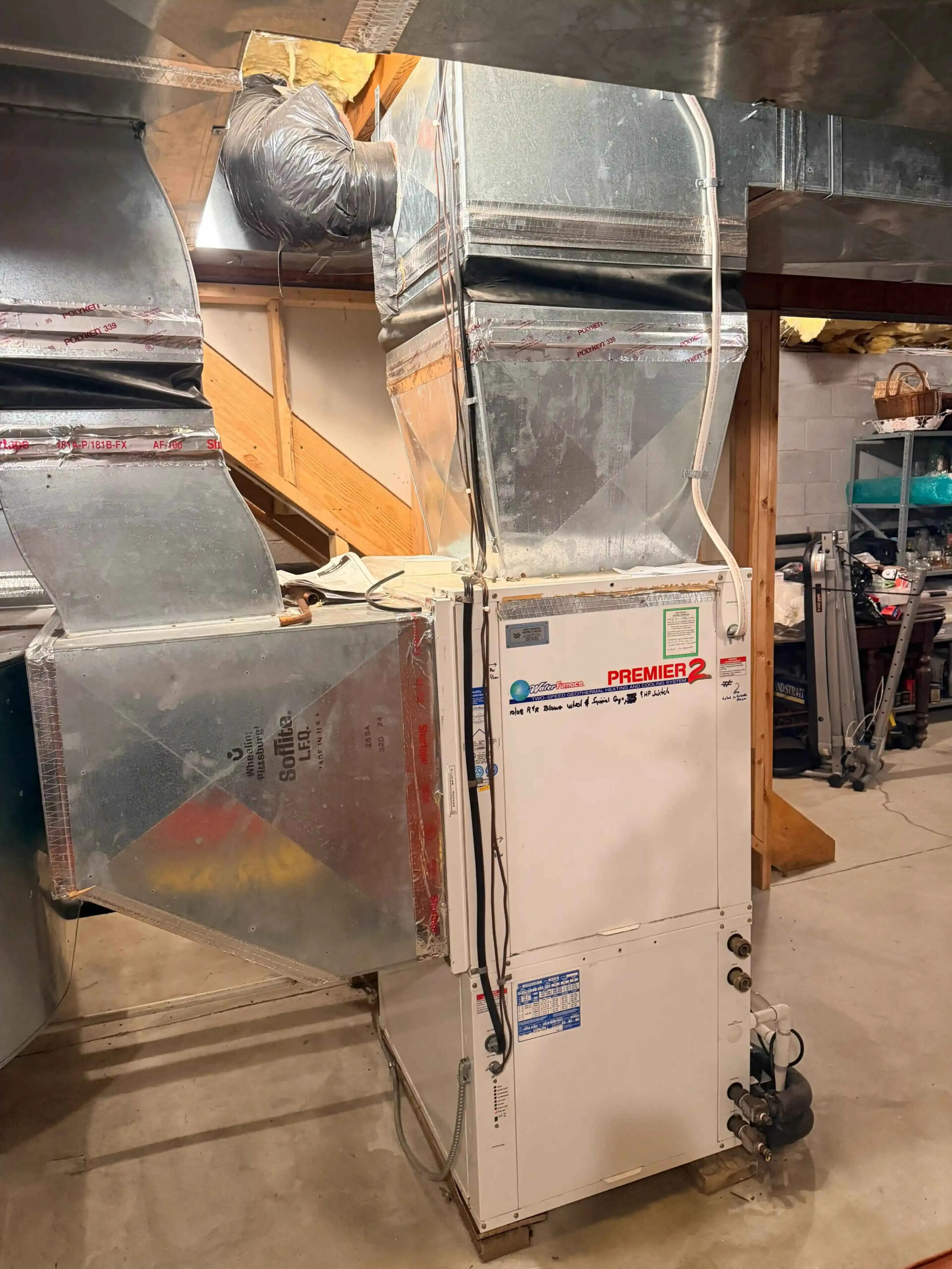 Traditional furnace in a home setting with warm air flowing through ductwork