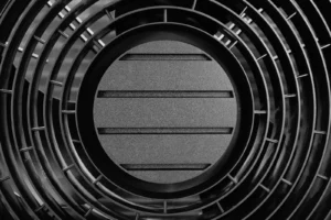 Close-up of HVAC equipment fan grate during a heating system tune-up