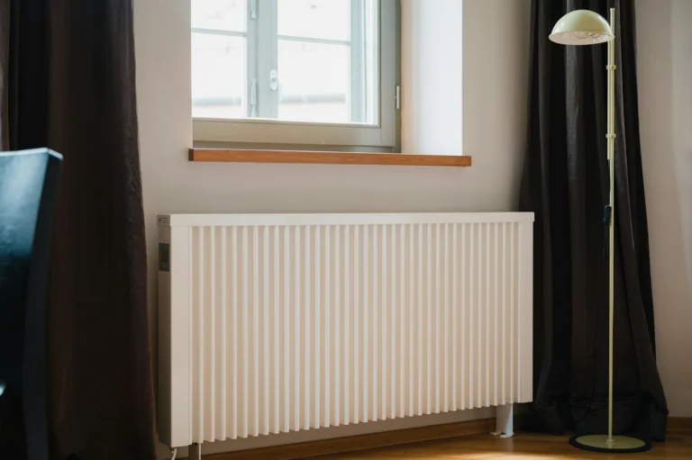 White radiator in a room heated by an oil boiler